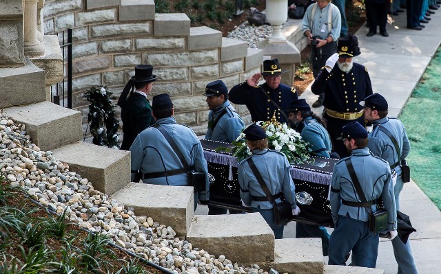 Salutes as Coffin enters Receiving Vault